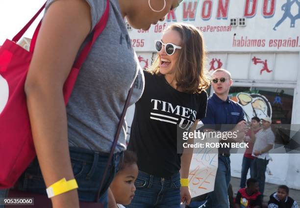 Actress Natalie Portman, wearing a "Time's Up" T-shirt, marches in the 33rd annual Kingdom Day Parade honoring Dr. Martin Luther King Jr., January...