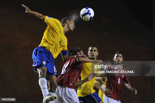 Gilberto Silva of Brazil, vies for the ball with Matias Fernandez of Chile during their FIFA World Cup South Africa 2010 football qualifier in...