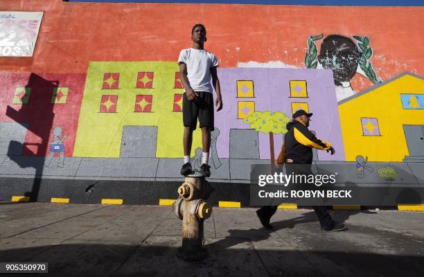 Dwight Marshall, a student at Wilder's Preparatory Academy Charter School in Inglewood awaits the start of the 33rd annual Kingdom Day Parade...