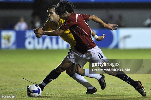 Chile´s Matias Ferandez vies for the ball with Brazil´s Felipe Melo during their FIFA World Cup South Africa-2010 qualifier football match at Pituacu...