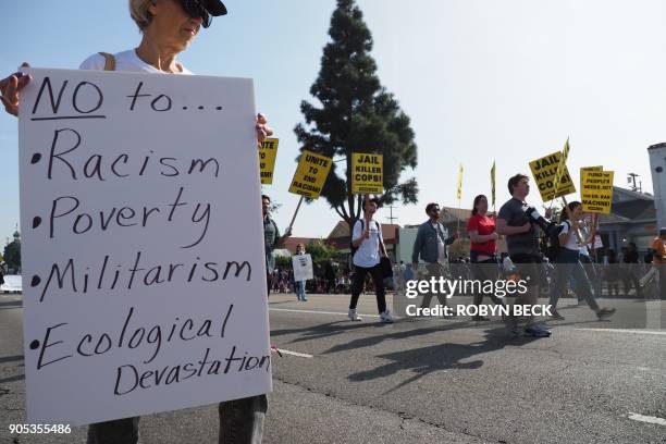 Small contingent protesting against racism marches in the 33rd annual Kingdom Day Parade honoring Dr. Martin Luther King Jr., January 15, 2018 in Los...