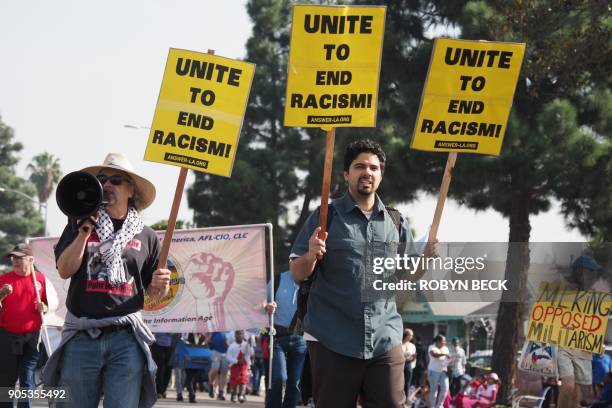 Small contingent protesting against racism marches in the 33rd annual Kingdom Day Parade honoring Dr. Martin Luther King Jr., January 15, 2018 in Los...