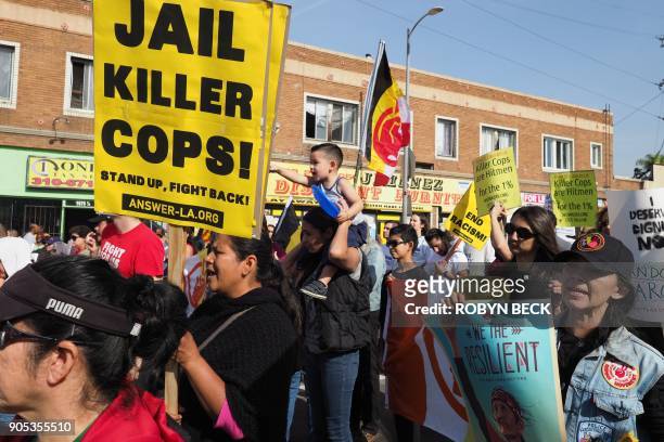 Small contingent protesting against racism and police violence marches in the 33rd annual Kingdom Day Parade honoring Dr. Martin Luther King Jr.,...