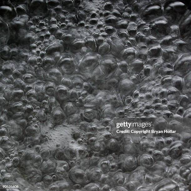 close up of water boiling water - boiling water stock pictures, royalty-free photos & images