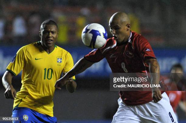 Chile´s Humberto Suazo gets ready to kick the ball near Brazil´s Julio Baptista during their FIFA World Cup South Africa-2010 qualifier football...