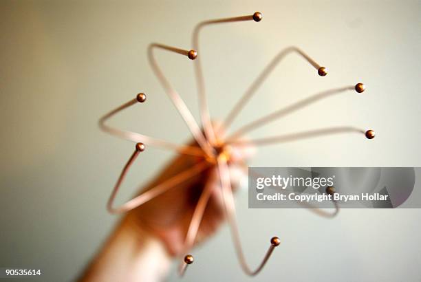 close up of multi pronged metal head massager - nerima stock pictures, royalty-free photos & images