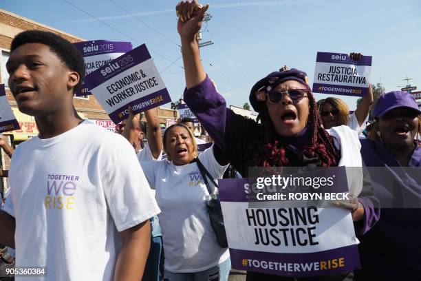 Union workers protest for housing justice as they march in the 33rd annual Kingdom Day Parade honoring Dr. Martin Luther King Jr., January 15, 2018...