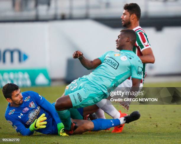 Jonathan Betancurt from Barcelona SC of Ecuador collides with goal keeper Marcos Felipe of Brazilian club Fluminense after scoring the seond of his...