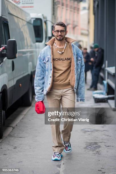 Simone Marchetti wearing denim jacket, beige sweatshirt, beige pants, sneaker is seen outside No21 during Milan Men's Fashion Week Fall/Winter...