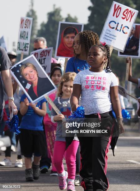 School girls march in the 33rd annual Kingdom Day Parade honoring Dr. Martin Luther King Jr., January 15, 2018 in Los Angeles, California. The theme...