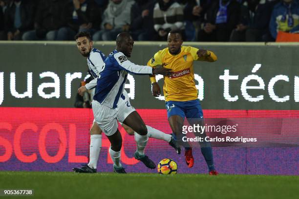 Porto's midfielder Danilo Pereira from Portugal vies with GD Estoril Praia forward Victor Andrade from Brazil for the ball possession during the...