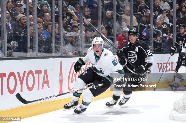 Justin Braun of the San Jose Sharks skates against Dustin Brown of the Los Angeles Kings during a game at STAPLES Center on January 15, 2018 in Los...