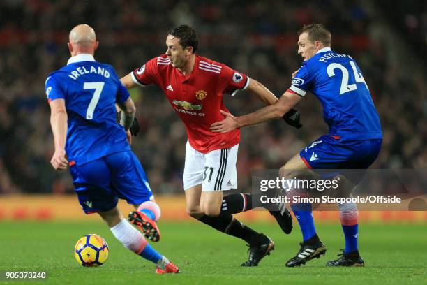 Nemanja Matic of Man Utd battles with Stephen Ireland of Stoke and Darren Fletcher of Stoke during the Premier League match between Manchester United...