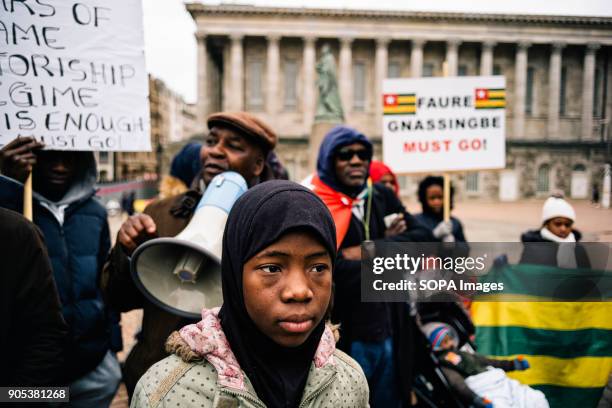 Girl looks on as the 'UK Togolese Diaspora High Council For Democracy and Change' holds a peaceful demonstration outside Birmingham Town Hall,...