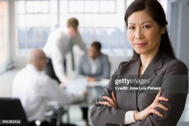 portrait of project manager with team on the background - portrait professional dark background stock pictures, royalty-free photos & images