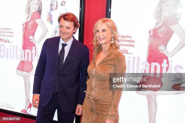 Michele Laroque and Francois Baroin are seen, during the "Brillantissime" Photocall, at Publicis Champs Elysees on January 15, 2018 in Paris, France.