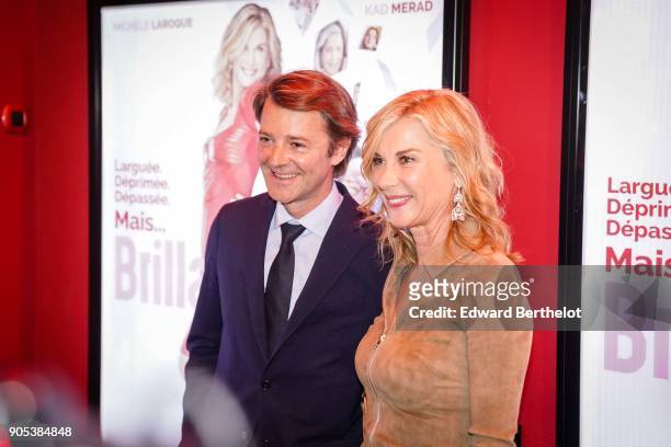 Michele Laroque and Francois Baroin are seen, during the "Brillantissime" Photocall, at Publicis Champs Elysees on January 15, 2018 in Paris, France.