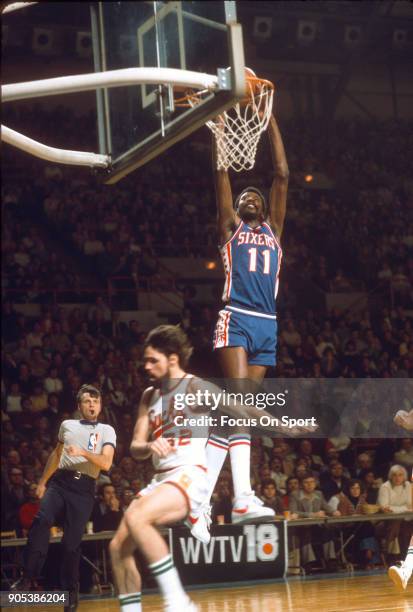 Caldwell Jones of the Philadelphia 76ers slam dunks over Brian Winters of the Milwaukee Bucks during an NBA basketball game circa 1977 at the MECCA...