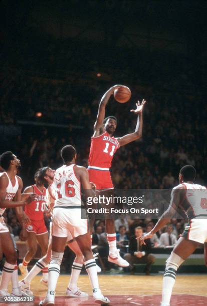 Caldwell Jones of the Philadelphia 76ers grabs a rebound against the Milwaukee Bucks during an NBA basketball game circa 1982 at the MECCA Arena in...