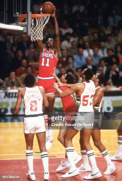 Caldwell Jones of the Philadelphia 76ers goes up to slam dunk against the Milwaukee Bucks during an NBA basketball game circa 1982 at the MECCA Arena...