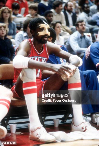 Caldwell Jones of the Philadelphia 76ers looks on from the bench against the Washington Bullets during an NBA basketball game circa 1980 at the...