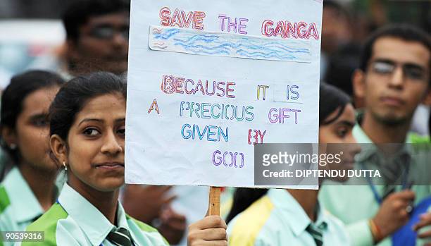 Indian school students hold placard as they take part in a 'Save the Ganga' rally in Allahabad on September 10, 2009. Some 5,000 students rallied to...