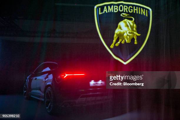 The Automobili Lamborghini SpA Urus sport utility vehicle sits behind a curtain during the 2018 North American International Auto Show in Detroit,...