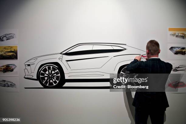 Mitja Borkert, design director for Automobili Lamborghini SpA, sketches a Urus sport utility vehicle during an event the 2018 North American...
