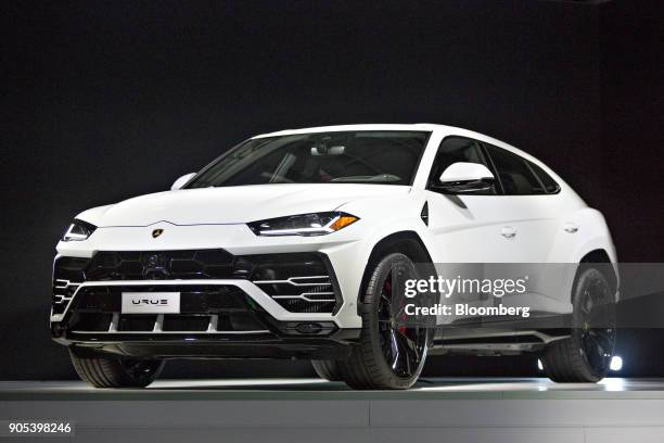 An Automobili Lamborghini SpA Urus sport utility vehicle sits on stage during the 2018 North American International Auto Show in Detroit, Michigan,...