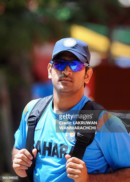 Indian cricket captain Mahendra Singh Dhoni arrives for a practice session at The R Premadasa Stadium in Colombo on September 10, 2009. India, New...