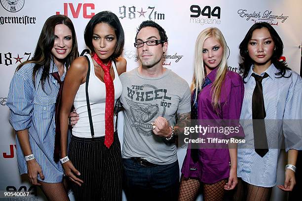 Owner of Room 101 Matt Booth poses with models at the launch of "Weiland For English Laundry" at The Roxy Theatre on September 9, 2009 in West...