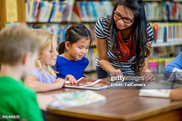 elementary school library - librarian stock pictures, royalty-free photos & images