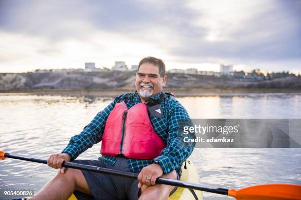 senior mexican couple kayaking - fat guy stock pictures, royalty-free photos & images