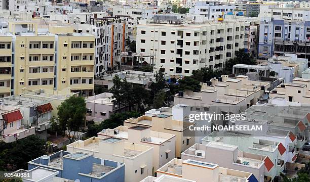 General view of newly constructed residential apartment buildings and row houses laying vacant on the outskirts of Hyderabad on September 10, 2009....