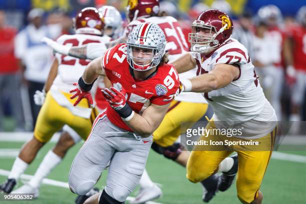 Ohio State Buckeyes defensive end Nick Bosa gets past the block of USC Trojans guard Andrew Vorhees during the Cotton Bowl Classic matchup between...