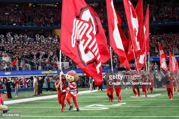 Ohio State Buckeyes mascot Brutus and the Ohio State cheerleaders lead the team out of the tunnel during the Cotton Bowl Classic matchup between the...