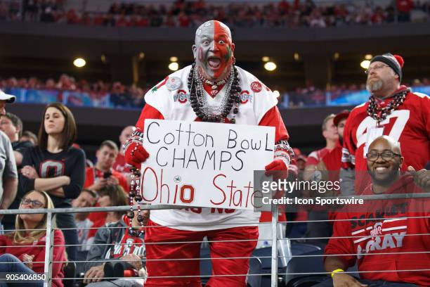 An Ohio State Buckeyes fan celebrates the Buckeyes' win during the Cotton Bowl Classic matchup between the USC Trojans and Ohio State Buckeyes on...