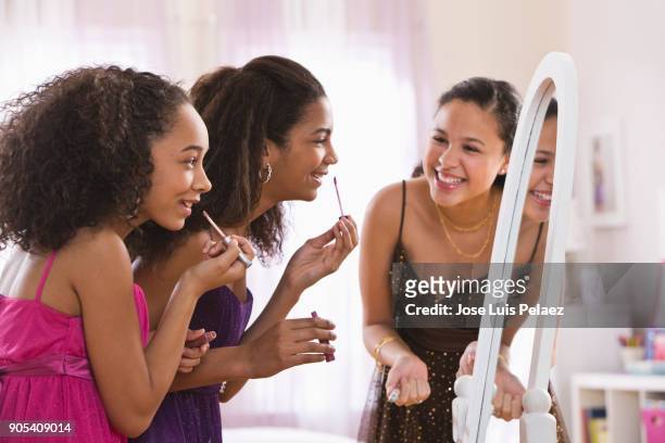 sisters getting ready together for homecoming dance - homecoming dance stock pictures, royalty-free photos & images