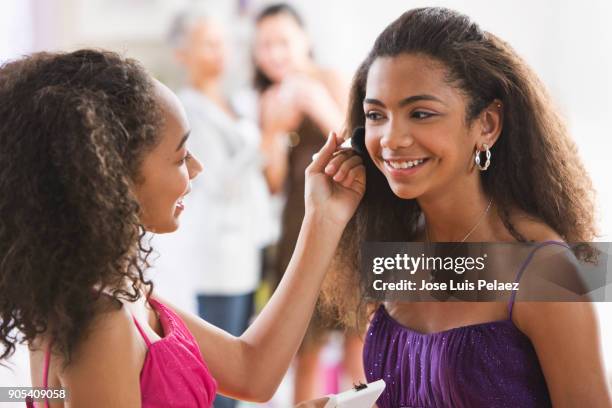 sisters getting ready for homecoming dance - homecoming dance stock pictures, royalty-free photos & images