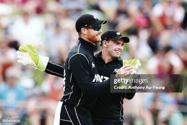 Martin Guptill and Tom Latham of New Zealand celebrate the wicket of Sarfraz Ahmed of Pakistan during game four of the One Day International Series...