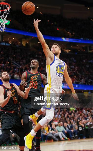 Stephen Curry of the Golden State Warriors shoots the ball over Jeff Green of the Cleveland Cavaliers at Quicken Loans Arena on January 15, 2018 in...