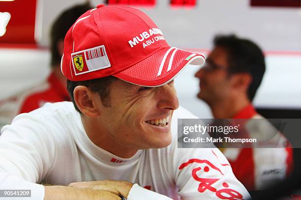 New Ferrari driver Giancarlo Fisichella of Italy familiarises himself with his car in the team garage during previews to the Italian Formula One...