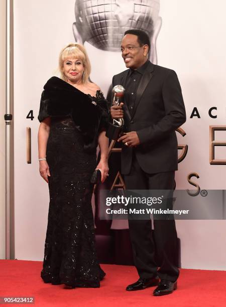 Charlie Wilson , recipient of the Music Makes a Difference award, and Mahin Wilson pose in the press room for the 49th NAACP Image Awards at Pasadena...