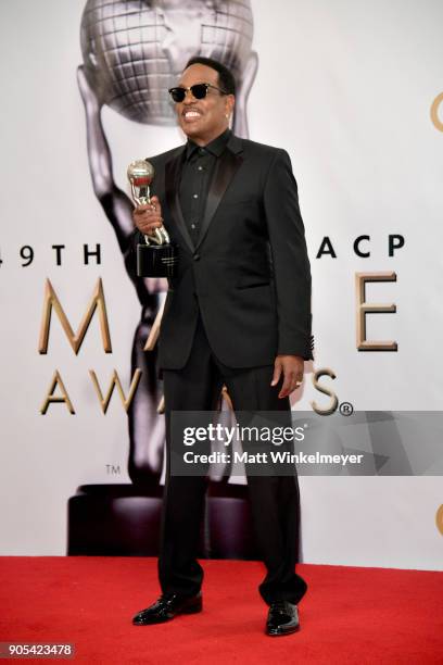 Charlie Wilson, recipient of the Music Makes a Difference award, and Mahin Wilson pose in the press room for the 49th NAACP Image Awards at Pasadena...