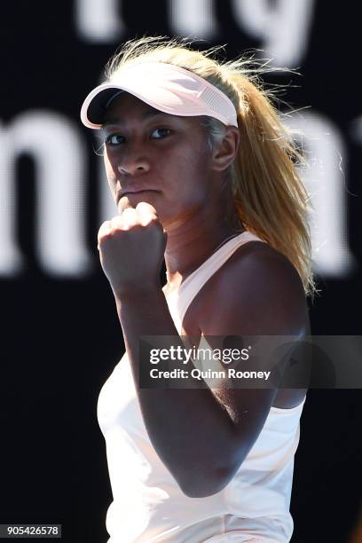 Destanee Aiava of Australia celebrates winning a point in her first round match against Simona Halep of Romania on day two of the 2018 Australian...