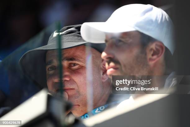 Andre Agassi watches the first round match between Novak Djokovic of Serbia and Donald Young of the United States on day two of the 2018 Australian...