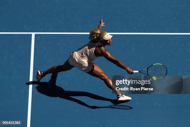 Destanee Aiava of Australia plays a backhand in her first round match against Simona Halep of Romania on day two of the 2018 Australian Open at...