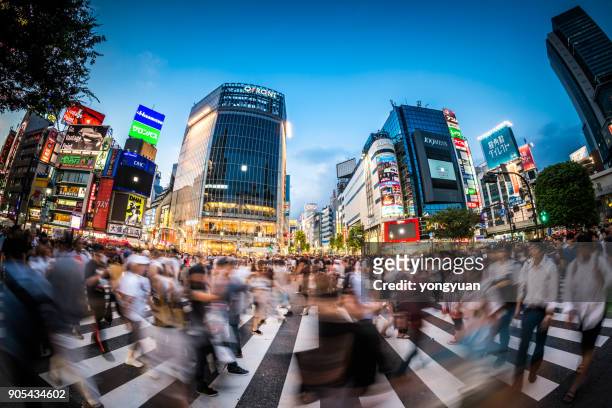 fisheye view of shibuya crossing - long exposure crowd stock pictures, royalty-free photos & images