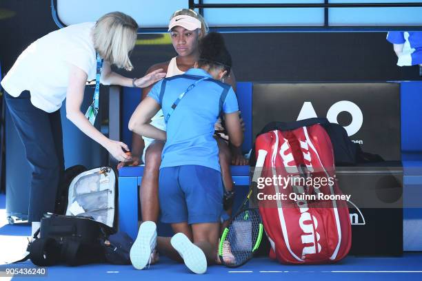 Destanee Aiava of Australia struggles between games in her first round match against Simona Halep of Romania on day two of the 2018 Australian Open...