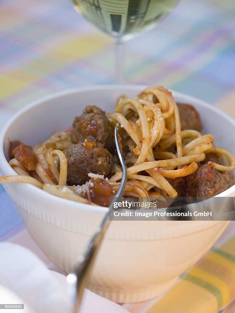 Linguine with meatballs and tomato sauce, close up